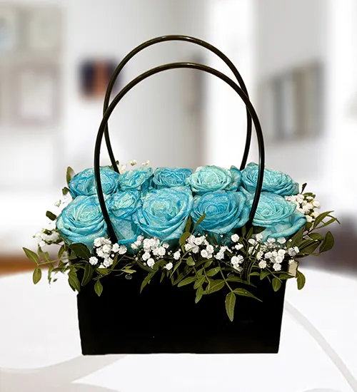 Blue roses in black bag Blue roses in black bag